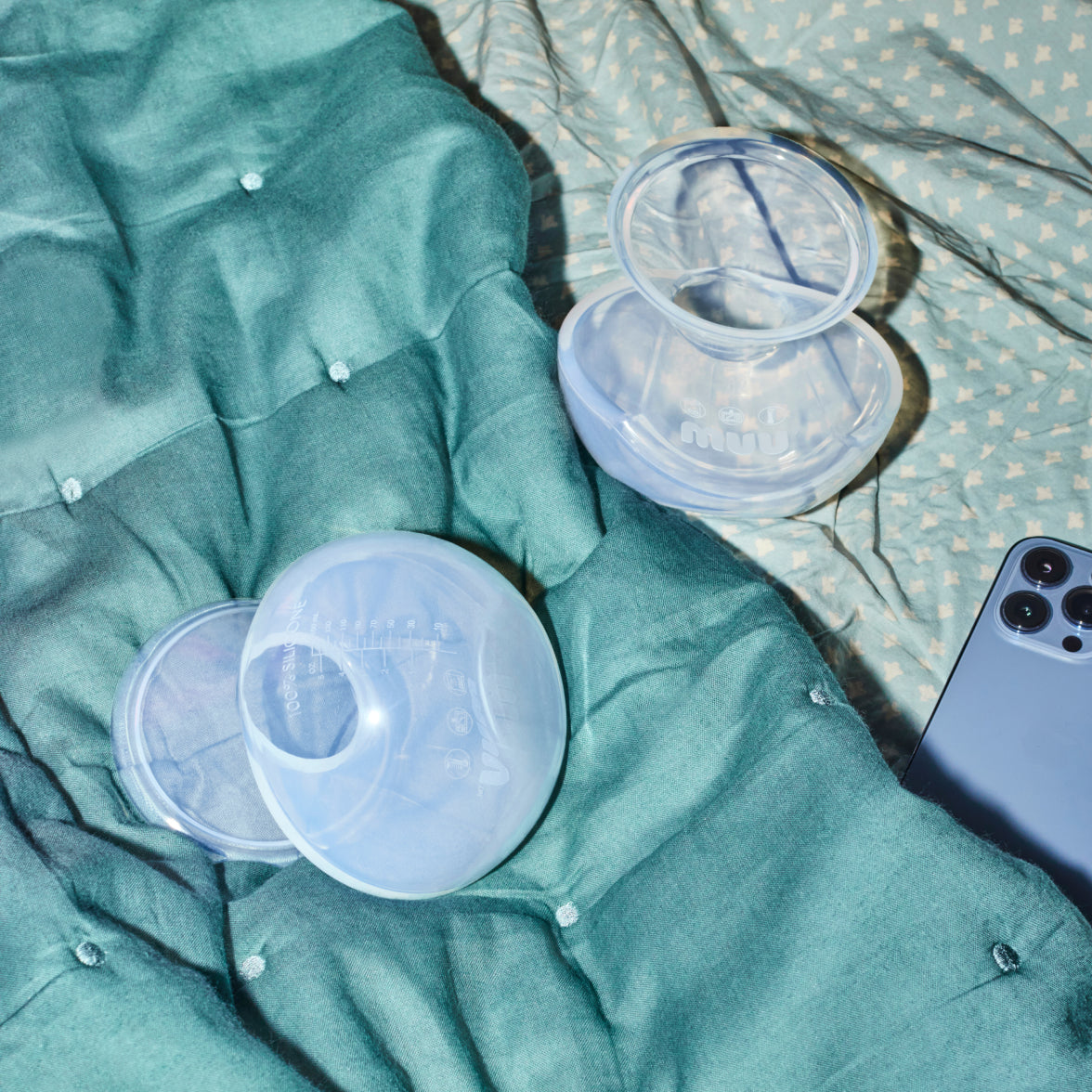 Two Muu pumps on a bed.